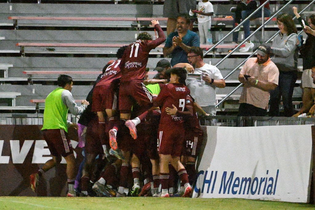 Chattanooga Red Wolves players celebrate their win over Charlotte Independences